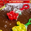image:imageJOYIN 60 PCS Christmas Mini Pop Stress Toy Bulk Xmas Pop Game Party Favors for Kids Christmas Stocking Stuffers for Children Adults Relieve Anxiety Stress Toy